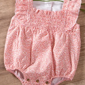 Pagliaccetto neonata in tela di cotone organico con scollo quadro e punto smock