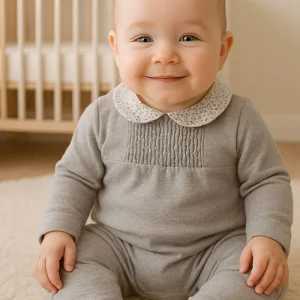 Tutina in caldo cotone organico con colletto fantasia floreale e taglio con punto smock